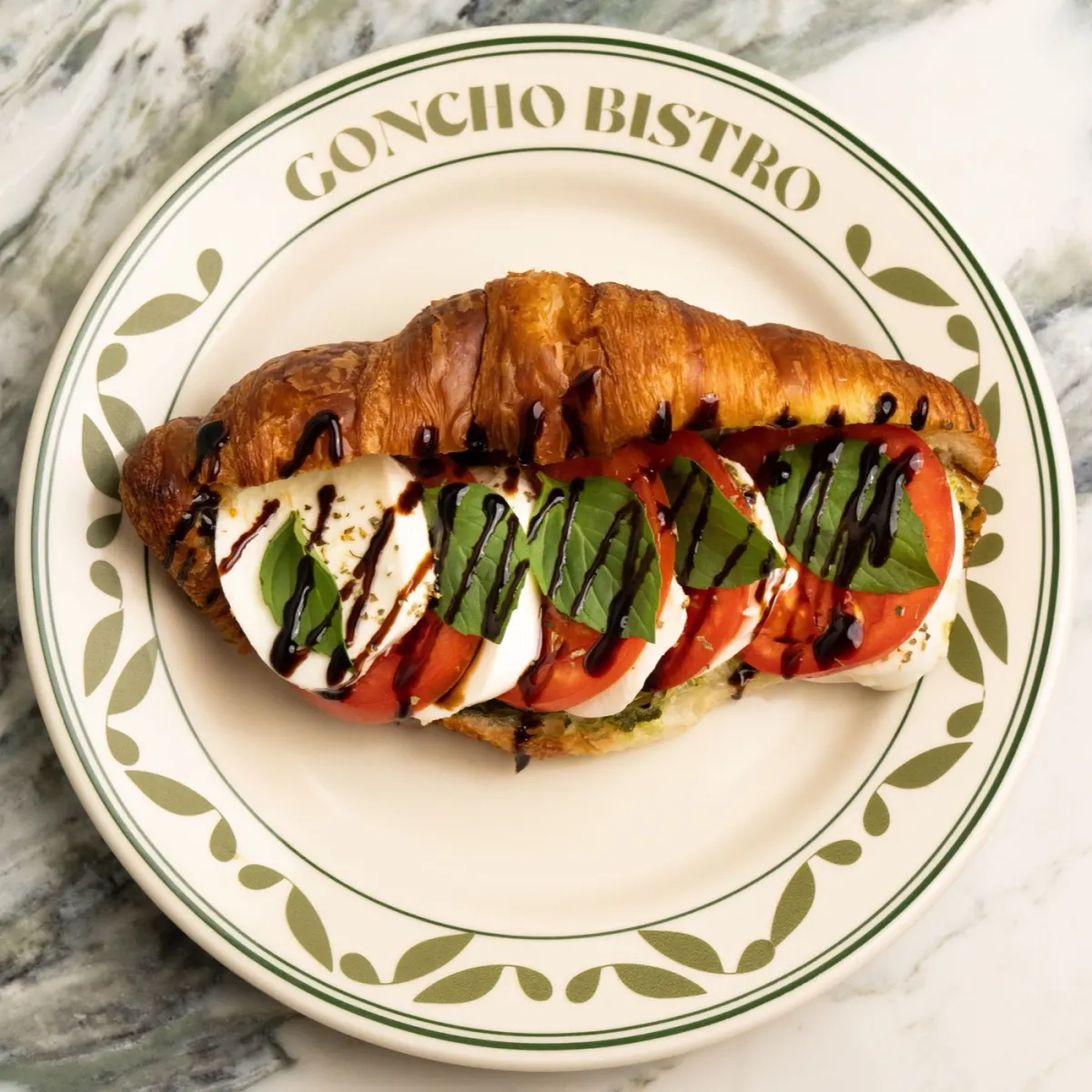 Caprese croissant with mozzarella, tomato and mint pesto
