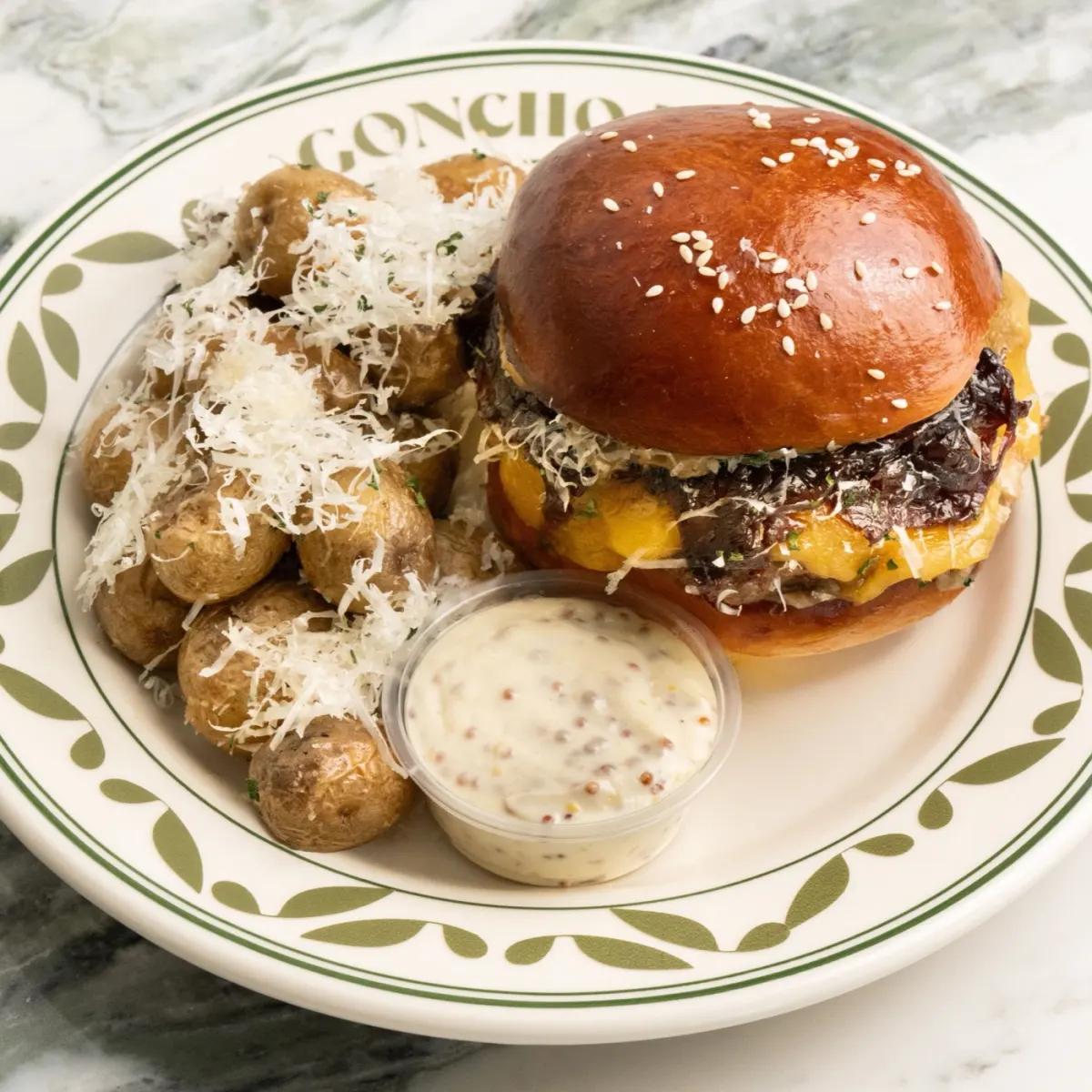 GONCHO burger combo with parmesan baby potatoes and dip